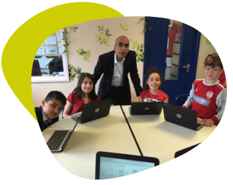 Children with teacher at after school ComputerXplorer clubs
