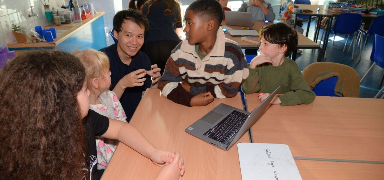 Khang and group of children, coding classes Southwark