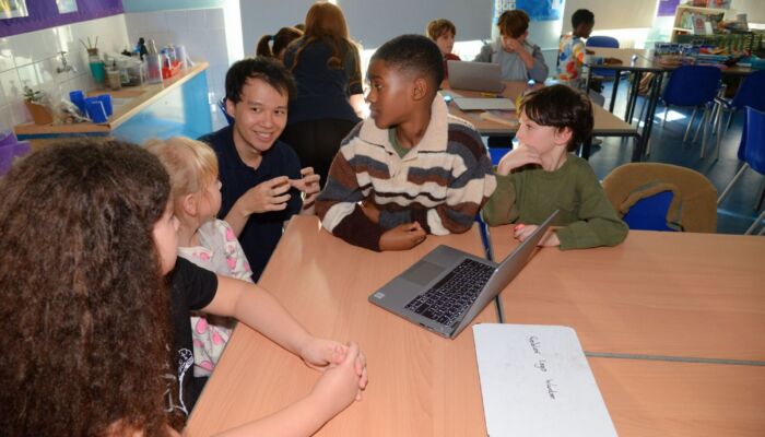Khang and group of children, coding classes Southwark